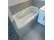 Stylish bathroom showcasing a pristine white tub and sleek vanity at 1022 S Lavina St, North Port, FL 34286