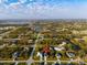 Neighborhood aerial view showcasing the home's location amidst lush surroundings at 122 Glades Dr, Rotonda West, FL 33947