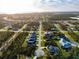 Wide aerial shot of homes in a serene neighborhood with mature trees and winding roads at 122 Glades Dr, Rotonda West, FL 33947