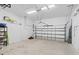 Clean garage with ample space for parking and storage featuring a rolling garage door at 122 Glades Dr, Rotonda West, FL 33947