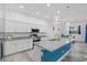 Modern kitchen with white cabinetry, granite countertops, and stainless steel appliances at 122 Glades Dr, Rotonda West, FL 33947