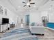 Bright living room with a comfortable couch and open access to the kitchen and dining areas at 122 Glades Dr, Rotonda West, FL 33947