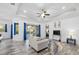 Cozy living room with a comfortable couch and access to an outdoor pool area at 122 Glades Dr, Rotonda West, FL 33947