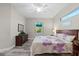 Bedroom features tile floors, ample natural light, and neutral decor at 122 Glades Dr, Rotonda West, FL 33947