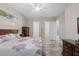 Bedroom with tile floors features an open en-suite bathroom at 122 Glades Dr, Rotonda West, FL 33947
