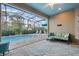 Inviting screened lanai with swimming pool, patio furniture, and a comfortable seating area at 122 Glades Dr, Rotonda West, FL 33947