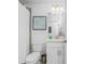 Clean bathroom with a white toilet, vanity, framed wall art and shower-curtained bath at 14204 Heritage Landing Blvd # 724, Punta Gorda, FL 33955