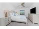 Comfortable bedroom with neutral tones, decorative pillows, and ambient lighting for relaxation at 14204 Heritage Landing Blvd # 724, Punta Gorda, FL 33955