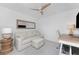 Bedroom featuring a comfortable sofa, stylish desk, and neutral tones for a relaxing ambiance at 14204 Heritage Landing Blvd # 724, Punta Gorda, FL 33955