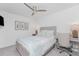 Bright bedroom with a ceiling fan, white walls, desk, and a comfortable bed at 14204 Heritage Landing Blvd # 724, Punta Gorda, FL 33955