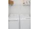 Functional laundry room with a washing machine and dryer, and storage at 14204 Heritage Landing Blvd # 724, Punta Gorda, FL 33955
