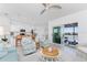 Open-concept living and kitchen area with modern furnishings, bar seating, and a view of the relaxing screened-in patio at 14204 Heritage Landing Blvd # 724, Punta Gorda, FL 33955