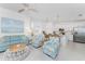 Spacious and bright living area featuring contemporary decor, an open layout, and a clear view into the modern kitchen space at 14204 Heritage Landing Blvd # 724, Punta Gorda, FL 33955