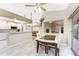 Open dining room connected to the kitchen, featuring a large window with backyard views at 15090 Buswell Ave, Port Charlotte, FL 33953