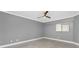 Neutral bedroom featuring gray walls, tile flooring, and a window at 1601 Park Beach Cir # 112/2, Punta Gorda, FL 33950