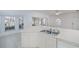 Kitchen area featuring tile floors, lots of natural light, and white cabinets at 1622 Red Oak Ln, Port Charlotte, FL 33948