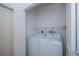 A laundry room containing a washer, dryer, and closet for storage at 1622 Red Oak Ln, Port Charlotte, FL 33948