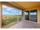 Relax on this tiled balcony with aluminum railings and a lovely view of the green landscape at 17495 Boca Vista Rd # 6, Punta Gorda, FL 33955