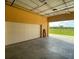 Garage featuring an EV charging station and a view of the outdoors at 17495 Boca Vista Rd # 6, Punta Gorda, FL 33955