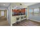 A pass-through kitchen with barstool seating and stainless steel appliances, offering a convenient entertaining space at 17495 Boca Vista Rd # 6, Punta Gorda, FL 33955