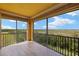 Screened-in lanai with a scenic view and tiled floors at 17495 Boca Vista Rd # 6, Punta Gorda, FL 33955