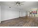 Inviting living room with sleek ceiling fan, and a seamless flow to the kitchen at 17495 Boca Vista Rd # 6, Punta Gorda, FL 33955