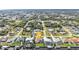 A neighborhood aerial view showcases a waterfront home with access to a canal at 18536 Alphonse Cir, Port Charlotte, FL 33948