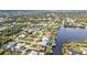 Scenic aerial view captures waterfront homes with private boat docks in a charming lake community at 18536 Alphonse Cir, Port Charlotte, FL 33948