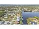 Aerial view features houses on a waterfront with docks and a serene canal neighborhood at 18536 Alphonse Cir, Port Charlotte, FL 33948