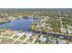 Large lakefront community featuring single-story homes, backyard docks, and lush natural landscaping at 18536 Alphonse Cir, Port Charlotte, FL 33948
