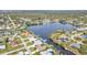 Beautiful aerial view showcasing waterfront homes with boat docks on a scenic lake community at 18536 Alphonse Cir, Port Charlotte, FL 33948