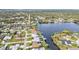 Scenic aerial view of waterfront homes with boat docks along a tranquil lake and canal community at 18536 Alphonse Cir, Port Charlotte, FL 33948