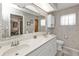 Stylish bathroom featuring a double sink vanity with updated fixtures and spacious counter tops at 18536 Alphonse Cir, Port Charlotte, FL 33948