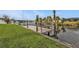 Well-maintained backyard dock along the canal with boat lift and green lawn at 18536 Alphonse Cir, Port Charlotte, FL 33948