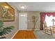 The foyer welcomes you with a wooden floor, leading into a living space at 18536 Alphonse Cir, Port Charlotte, FL 33948