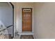 The home features a solid front door with a decorative window, framed by a white exterior at 18536 Alphonse Cir, Port Charlotte, FL 33948