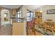 Open kitchen design with bar seating and access to dining area with pool views at 18536 Alphonse Cir, Port Charlotte, FL 33948