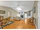 Sunlit living room with vaulted ceiling, stone fireplace, and comfortable seating at 18536 Alphonse Cir, Port Charlotte, FL 33948