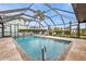 Outdoor pool is surrounded by a screened enclosure for privacy at 18536 Alphonse Cir, Port Charlotte, FL 33948