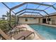 Relaxing screened pool with lounge chairs and a peaceful atmosphere for leisure and enjoyment at 18536 Alphonse Cir, Port Charlotte, FL 33948