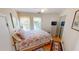 Cozy bedroom with dresser, closet, and windows at 19170 Aviation Ct, Port Charlotte, FL 33948