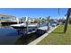 Boat lift on a canal, offering convenient access to water activities at 19170 Aviation Ct, Port Charlotte, FL 33948