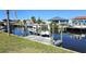Dock view with a boat lift on a canal, perfect for boating enthusiasts at 19170 Aviation Ct, Port Charlotte, FL 33948