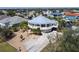 Unique circular home with a metal roof, waterfront access, balconies, and a spacious driveway at 19170 Aviation Ct, Port Charlotte, FL 33948