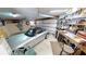 Garage features ample storage, work bench, and a silver convertible at 19170 Aviation Ct, Port Charlotte, FL 33948