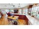 Bright kitchen with wood cabinets, an island and a breakfast nook overlooking the living area at 19170 Aviation Ct, Port Charlotte, FL 33948