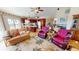 Spacious living area with a kitchen island, dining area, and comfortable furniture at 19170 Aviation Ct, Port Charlotte, FL 33948