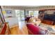 Cozy living room with a piano, comfortable seating, and a view of the outdoor patio at 19170 Aviation Ct, Port Charlotte, FL 33948