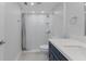 Modern bathroom featuring a sink, toilet, and a tiled walk-in shower at 19505 Quesada Ave # Ss102, Port Charlotte, FL 33948