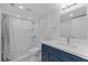 Modern bathroom featuring a sink, toilet, and a tiled walk-in shower at 19505 Quesada Ave # Ss102, Port Charlotte, FL 33948